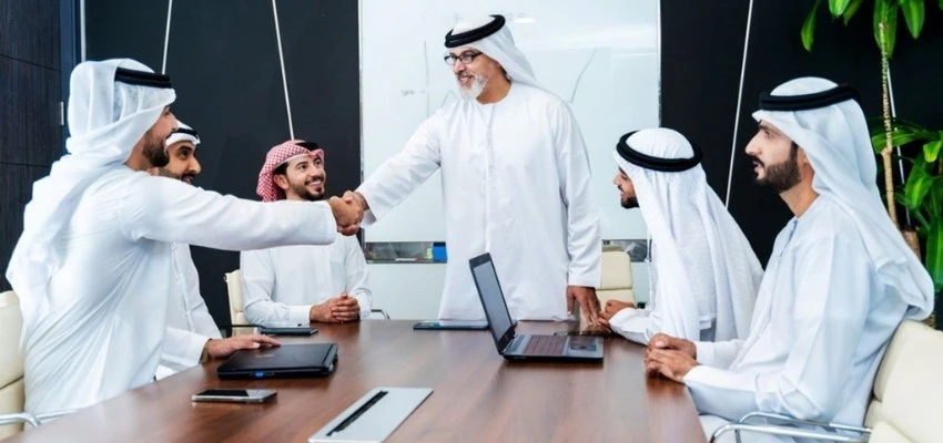 Arab business team meeting for tender evaluation and ISO compliance in Qatar